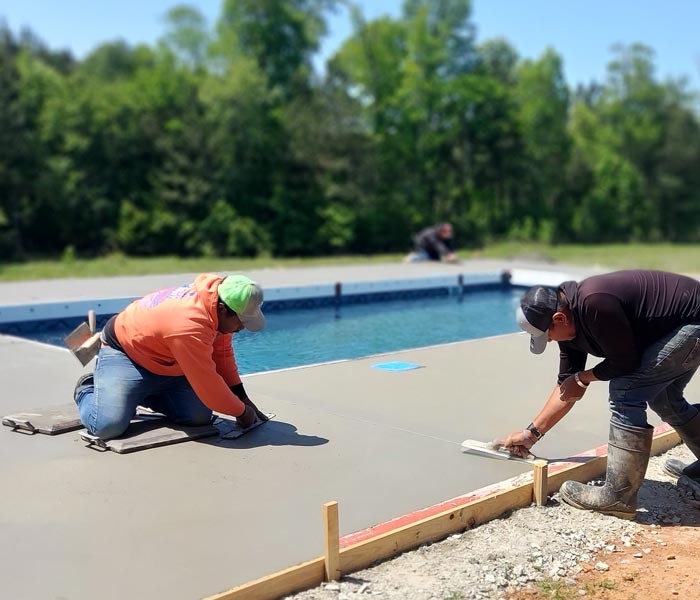 concrete finishers on pool deck surface